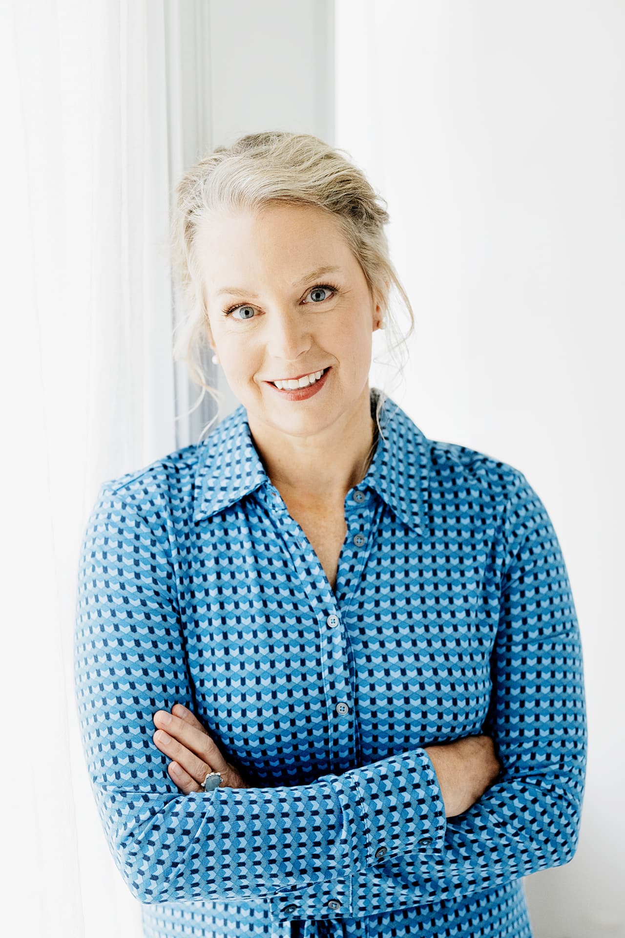 Michelle Roy, PA-C, smiling in a blue patterned shirt